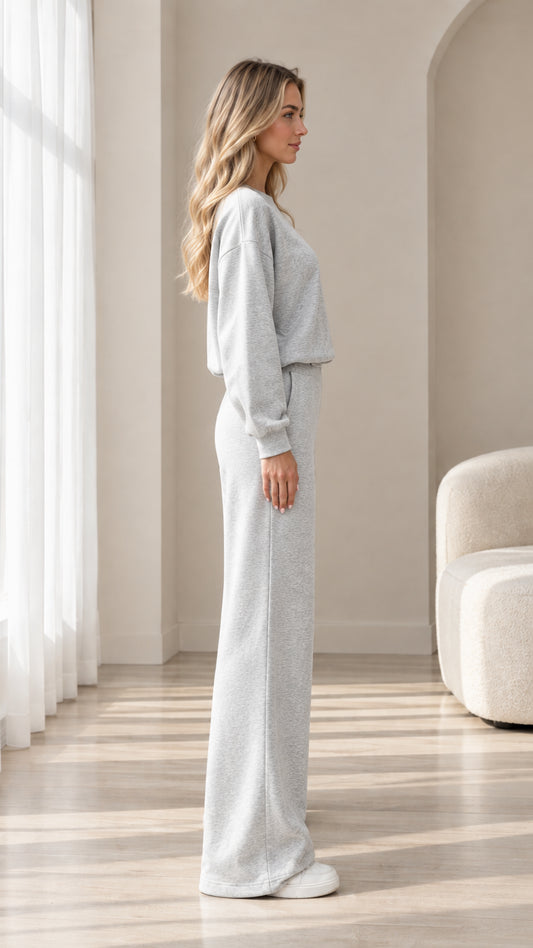 Side profile view of model wearing heather grey wide leg lounge set