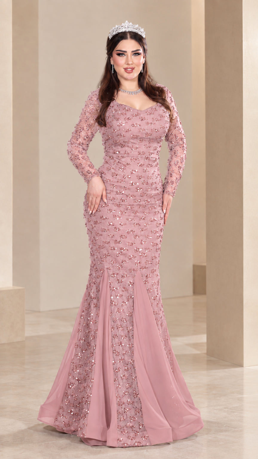 Front view of model wearing dusty pink sequin long sleeve mermaid evening gown