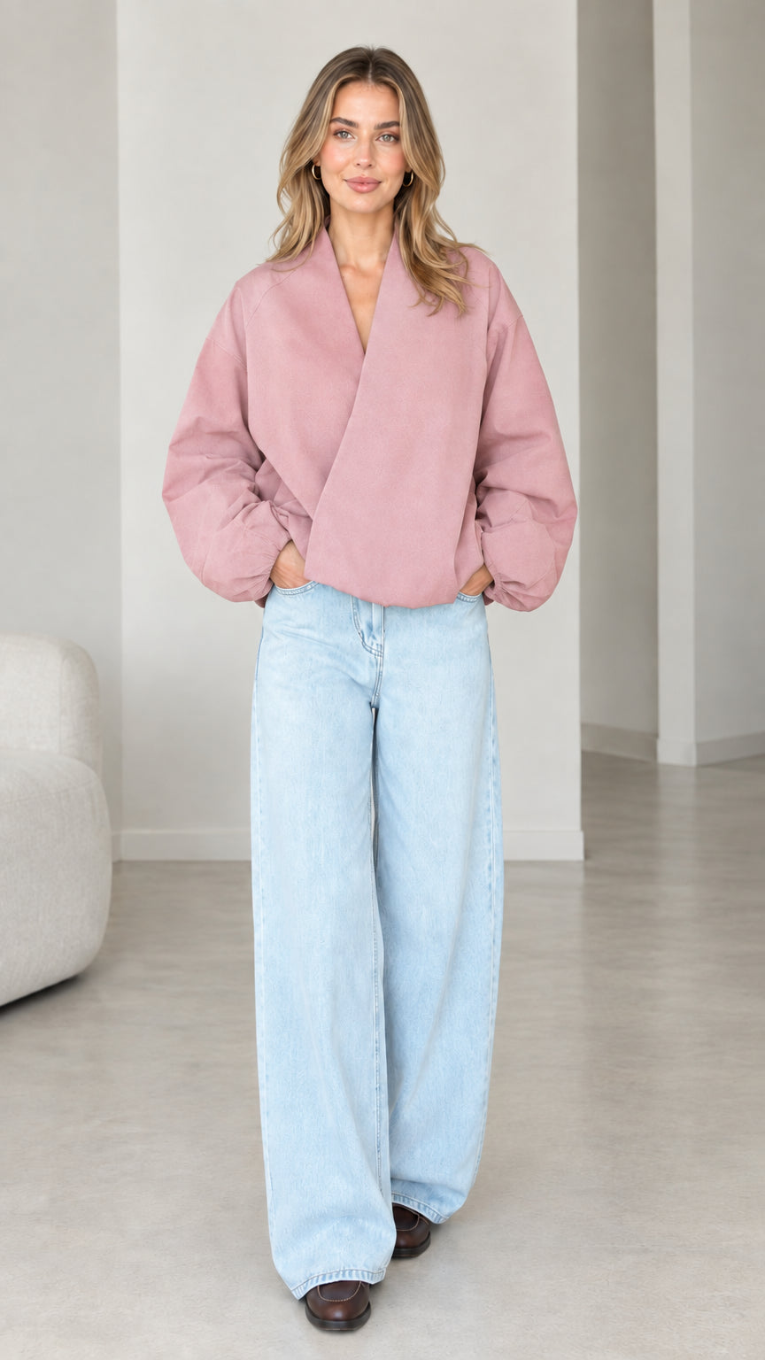 Model wearing Dusty Pink crossover V-neck balloon sleeve wrap top