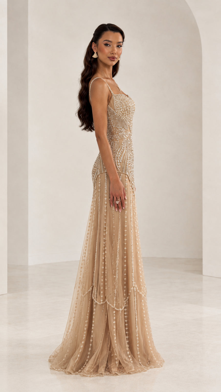 Side profile of woman in Champagne embellished sequin floor-length formal dress