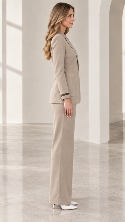 Side profile view of taupe two-piece suit set showing streamlined fit