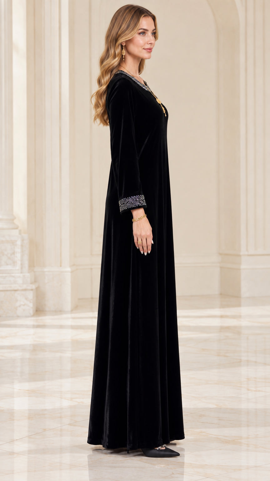 Side profile view of elegant black velvet evening maxi dress