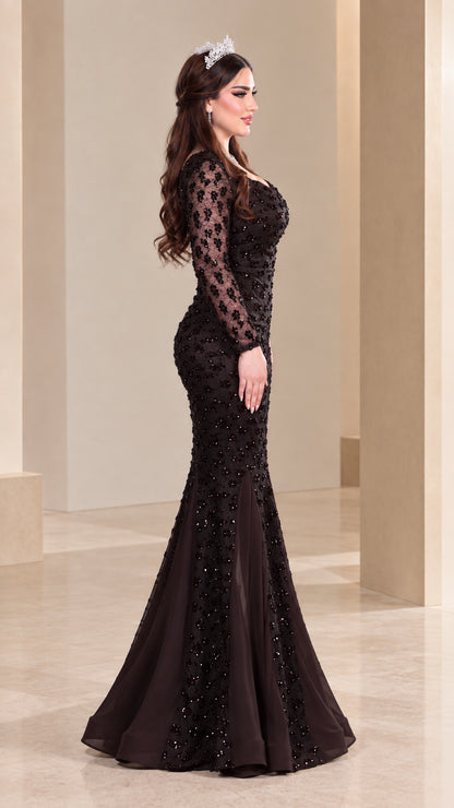 Side profile of model in dark brown sequin formal gown with flowing train