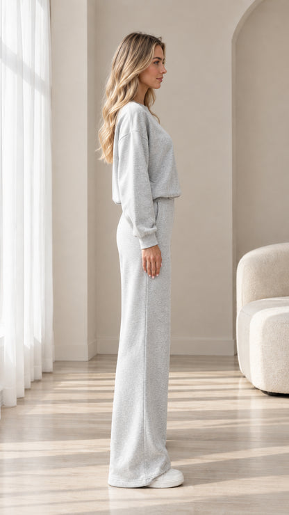 Side profile view of model wearing heather grey wide leg lounge set