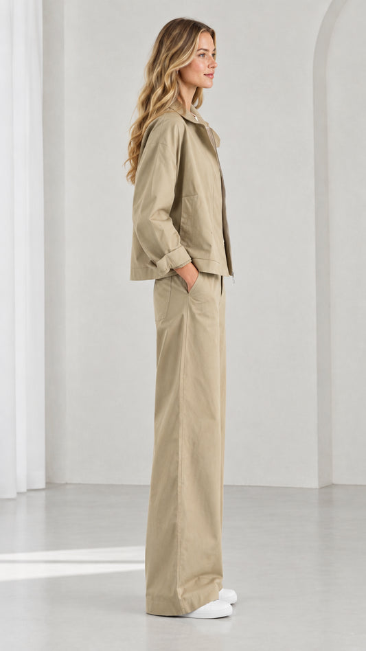 Side profile view of women's khaki matching jacket and wide-leg trousers