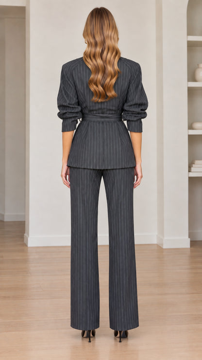 Back view of women's charcoal grey pinstripe tailored jacket and pants