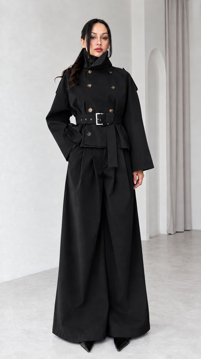 Model wearing Black double-breasted cropped trench jacket and matching wide-leg trousers