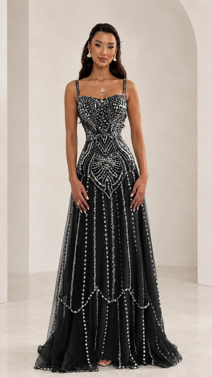 Front view of woman wearing Black sequin beaded sweetheart tulle evening gown