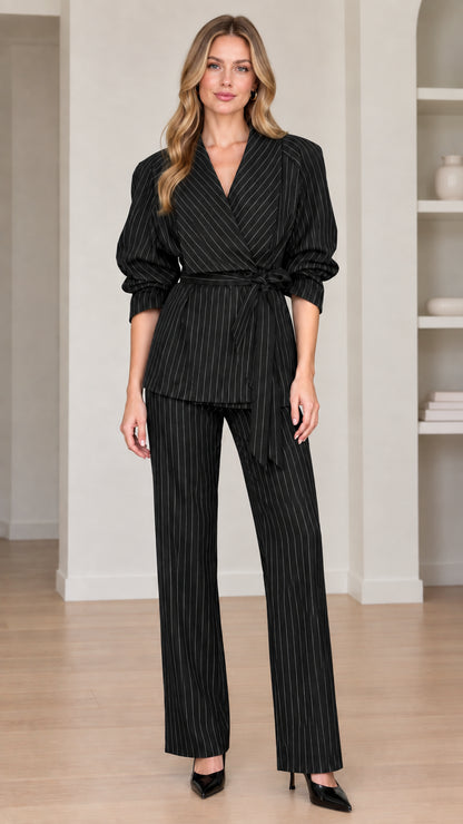Full view of women's black pinstripe wrap blazer and matching trouser suit