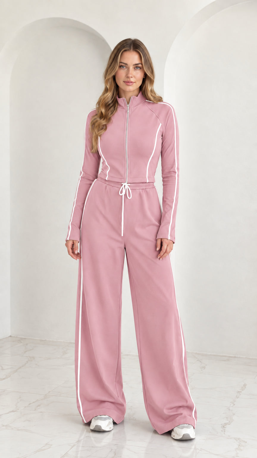 Full front view of model wearing Dusty Pink 2-piece zip-up tracksuit set with white piping