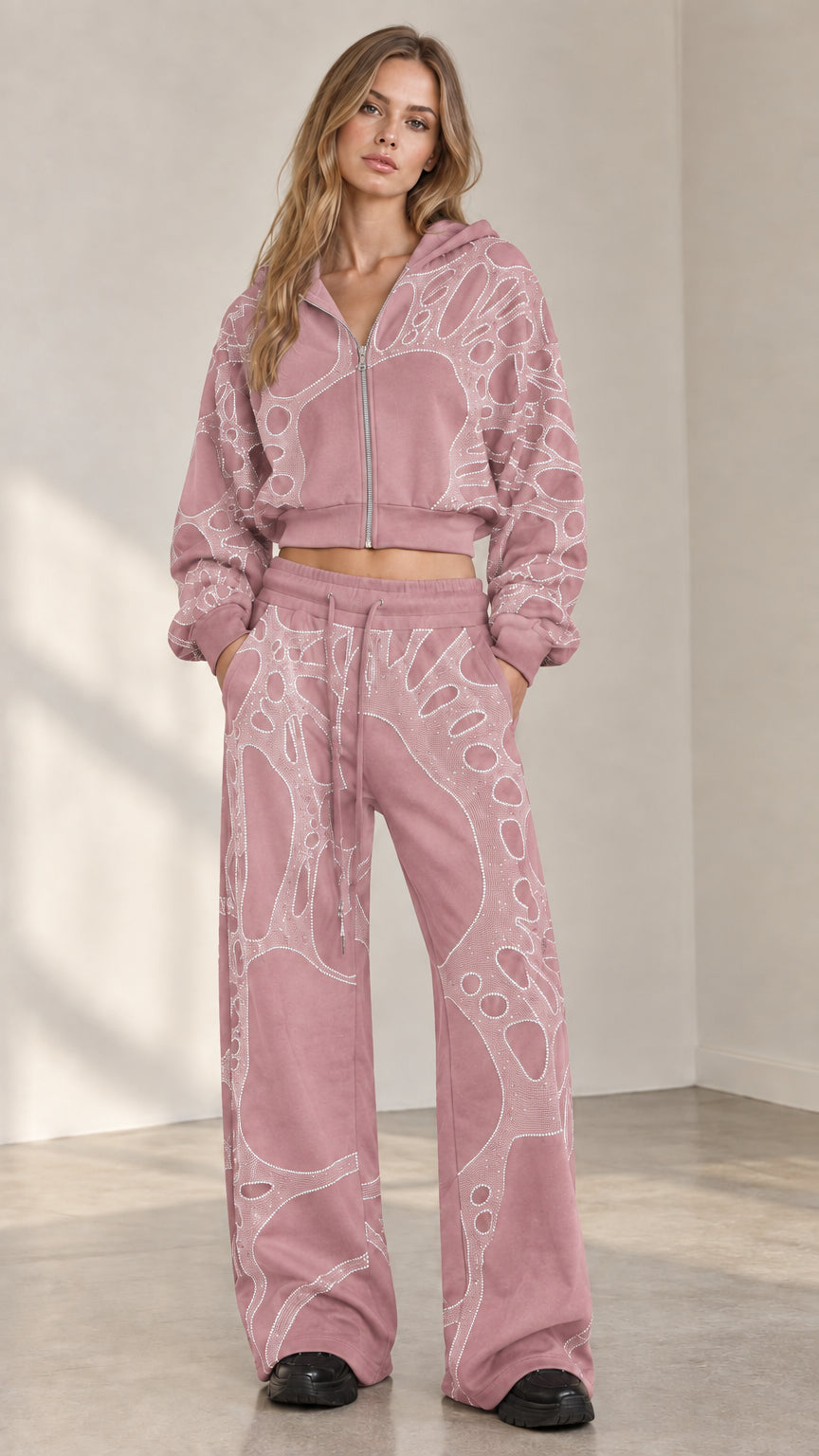 Woman wearing dusty pink rhinestone cropped zip hoodie and wide leg sweatpants set
