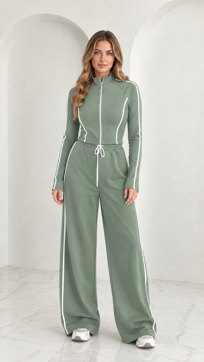 Full front view of model wearing Sage Green 2-piece zip-up tracksuit set with white piping