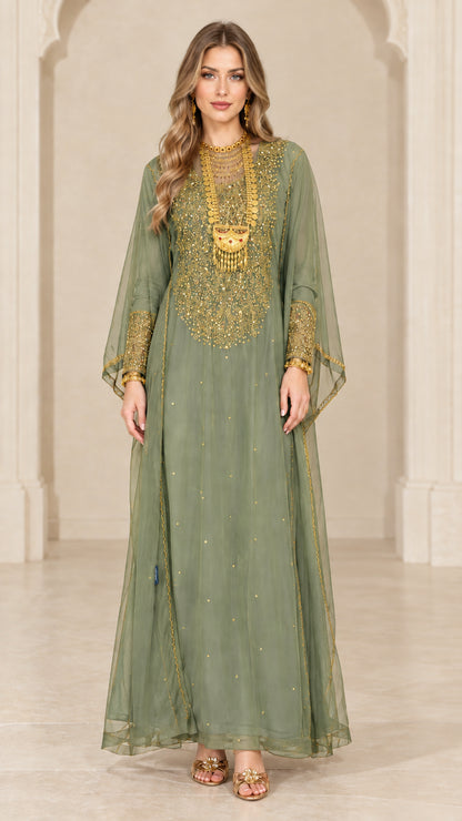 Front view of woman wearing sage green embroidered sheer overlay maxi kaftan gown