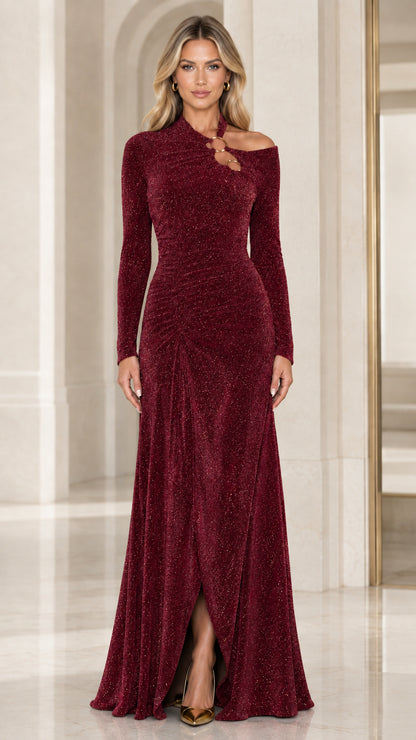 Front full-length view of burgundy glitter cutout long sleeve evening gown