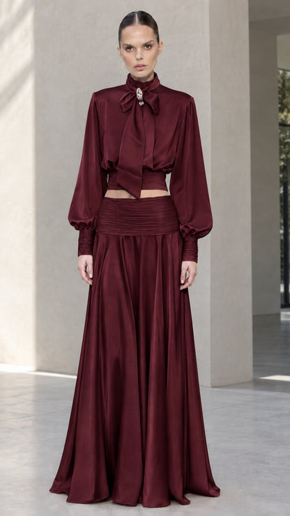 Full-length front view of burgundy wine satin bow tie blouse and maxi skirt set