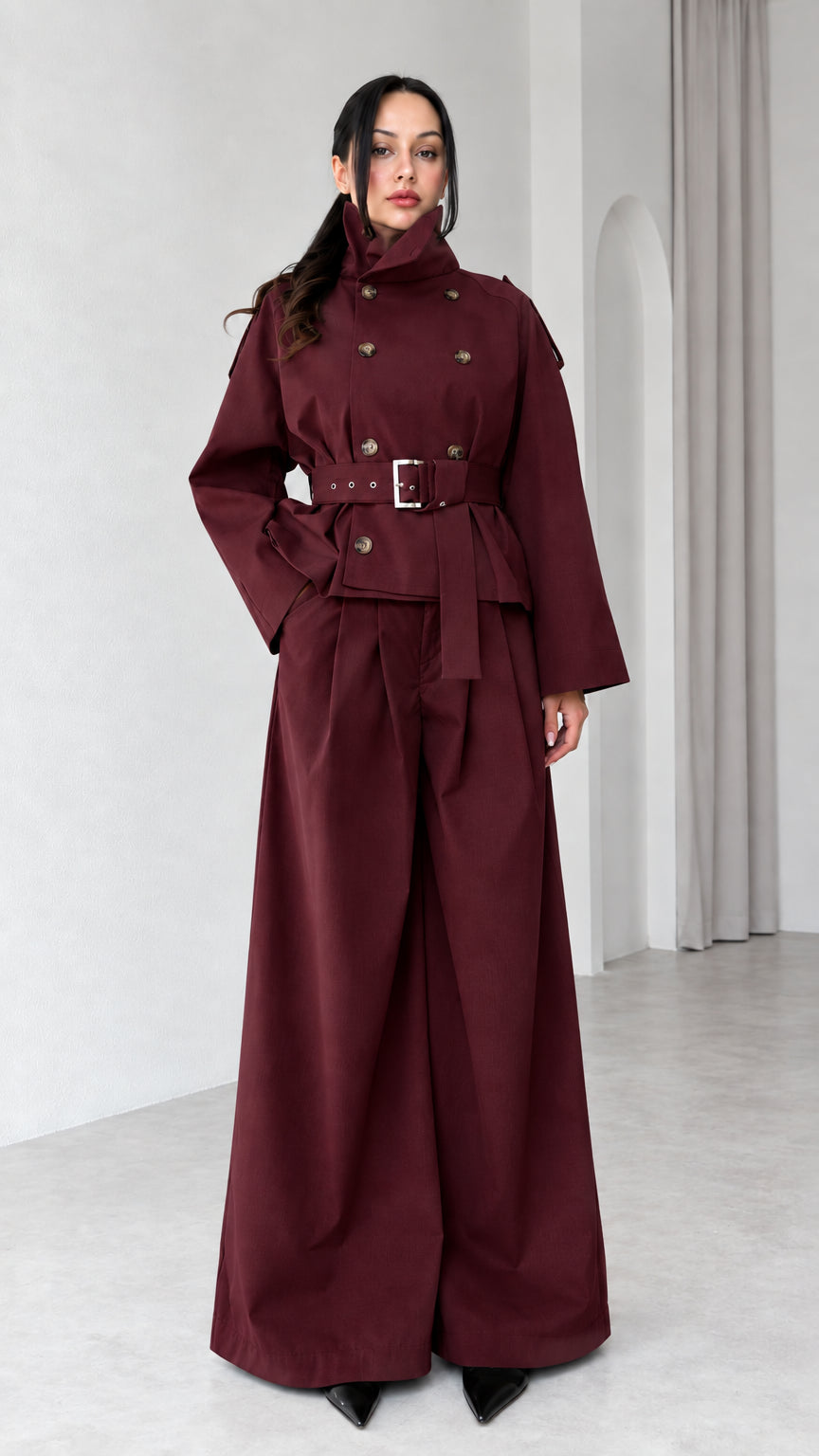 Model wearing Burgundy high-neck double-breasted trench jacket and wide-leg pant set