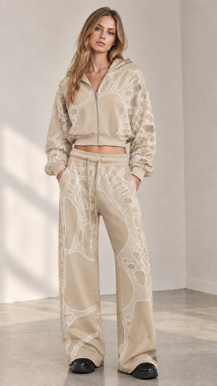 Woman wearing beige oatmeal rhinestone cropped zip hoodie and wide leg sweatpants set