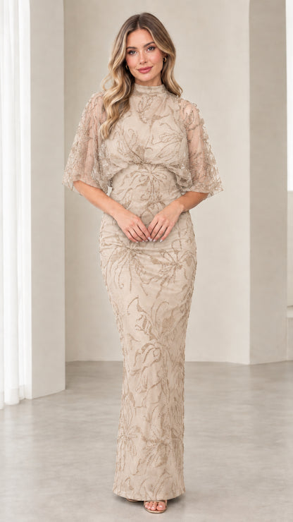 Model wearing Champagne beaded evening dress with sheer flutter sleeves